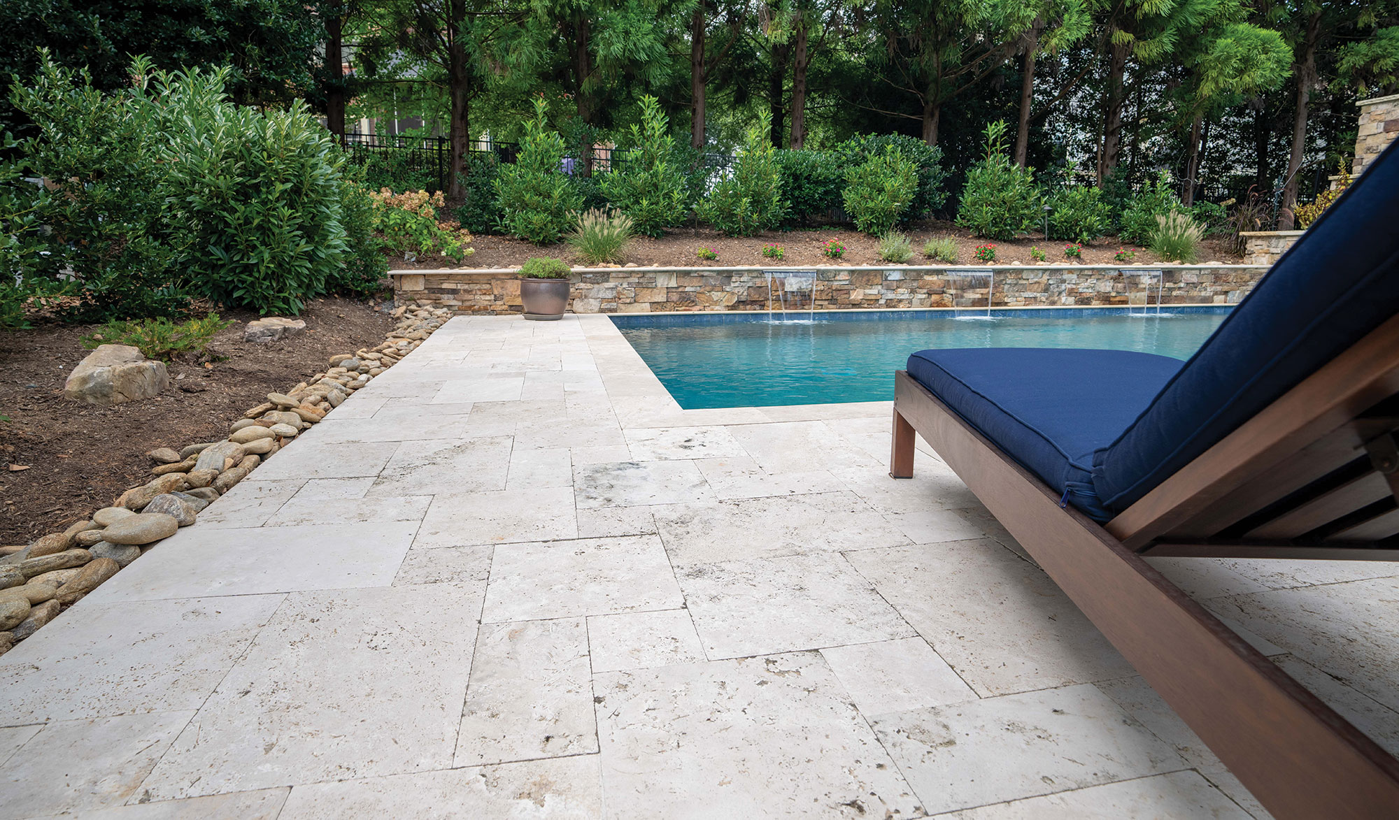 Elevate Your Pool Space with Natural Stone and Porcelain